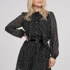 Gestippelde jurk met strik detail