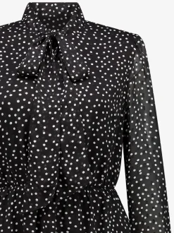 Gestippelde jurk met strik detail