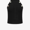 Top met N-logo knopen